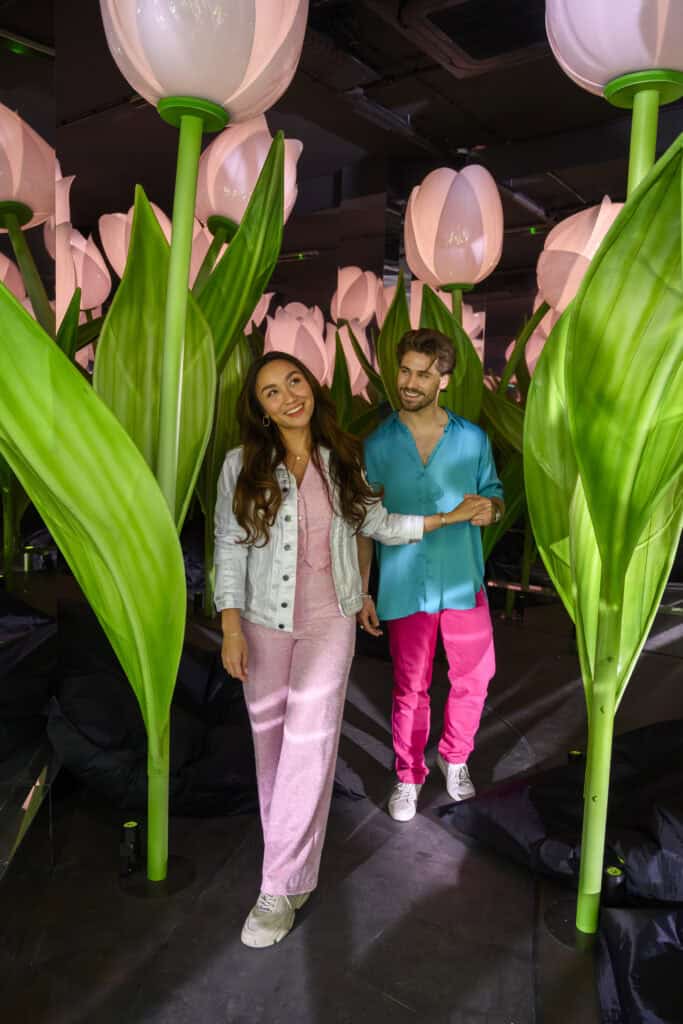couple-walking-through-tulips-at-highlights-of-holland