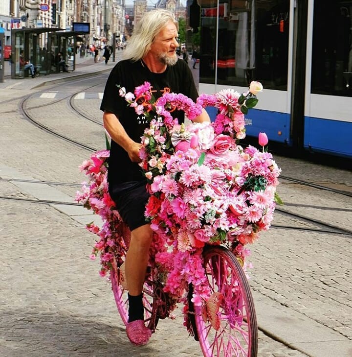 Photo-of-Amsterdam's-flower-bike-man-warren-ridin-one-of-his-own-creations