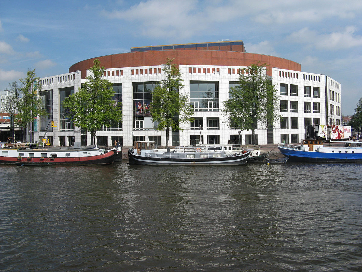 Photo-of-national-opera-and-ballet-building-in-amsterdam-from-across-the-amsterl-river