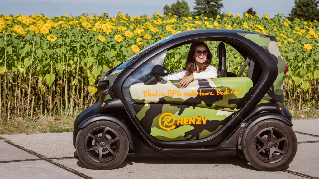 Woman-smiling-sitting-in-renzy-car-on-tour-around-Dutch-flower-fields