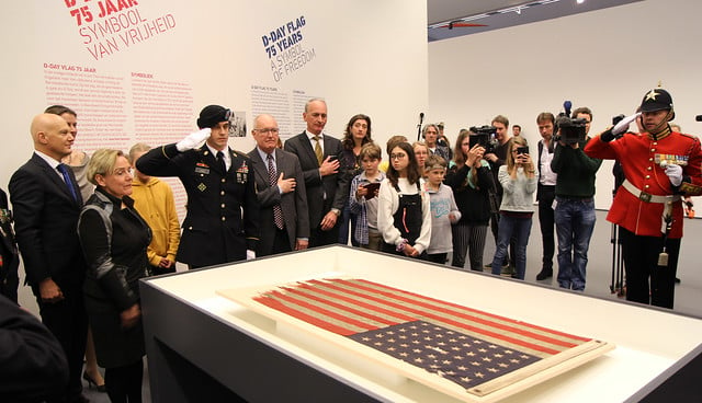 A US Flag used on D-Day is handed over to Dutch art collecter Kreuk in 2016.