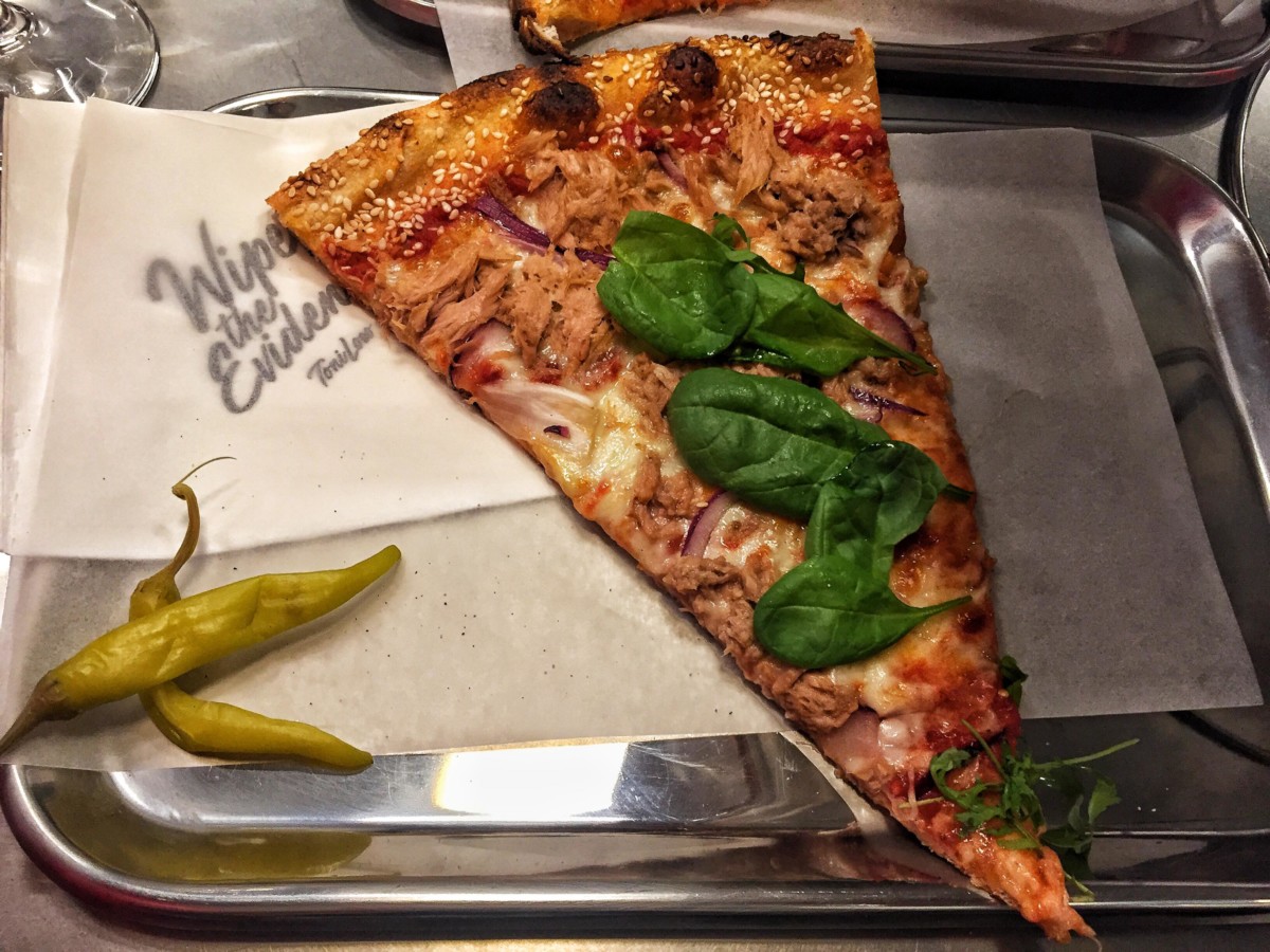 One-slice-of-pizza-with-meat-from-toni-locos-pizzeria-in-amsterdam-the-netherlands