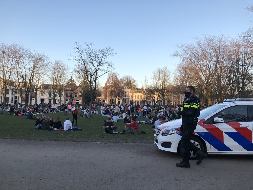 Photo-of-crowded-park-and-Dutch-police-officer-Netherlands