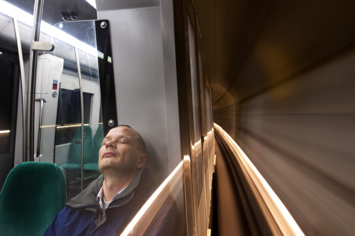 man sleeping on night train