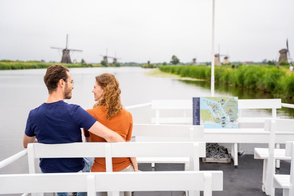photo-of-couple-taking-a-boat-tour-of-kinderdijk 