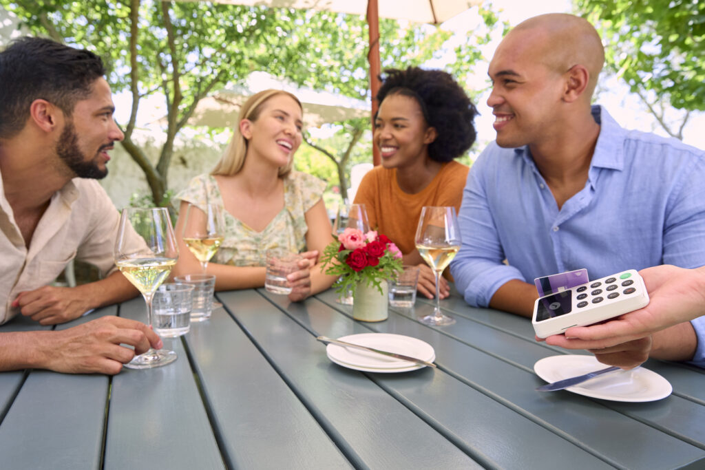 A-photo-of-a-group-of-friends-having-drinks-and-splitting-the-bill