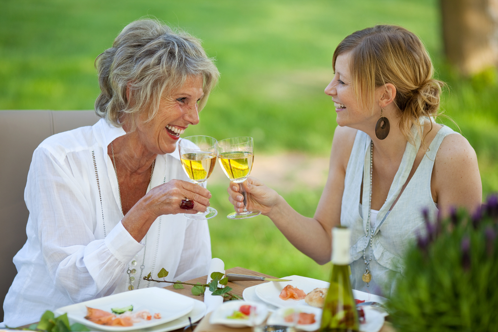 adult-mother-and-daughter-drinking-wine