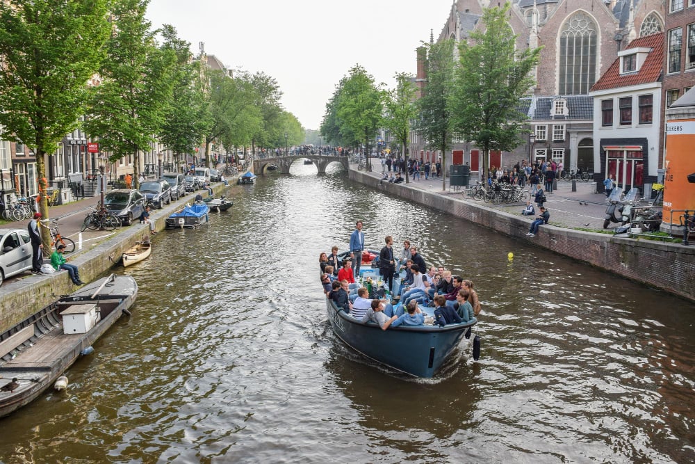 People-on-rented-boat-on-Amsterdam-canals-Netherlands