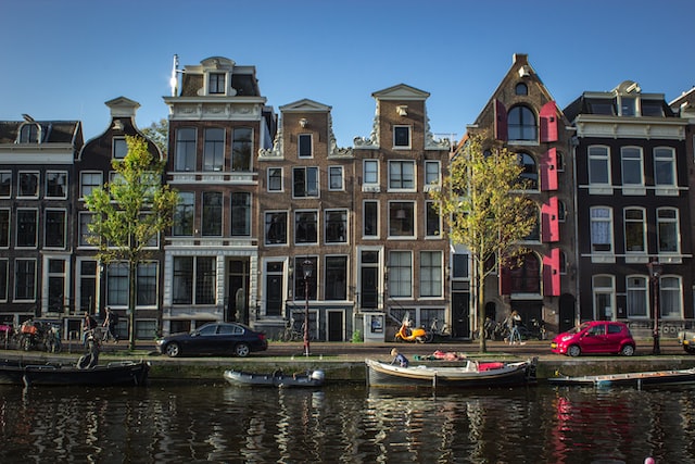 amsterdams open windows and houses along the canal