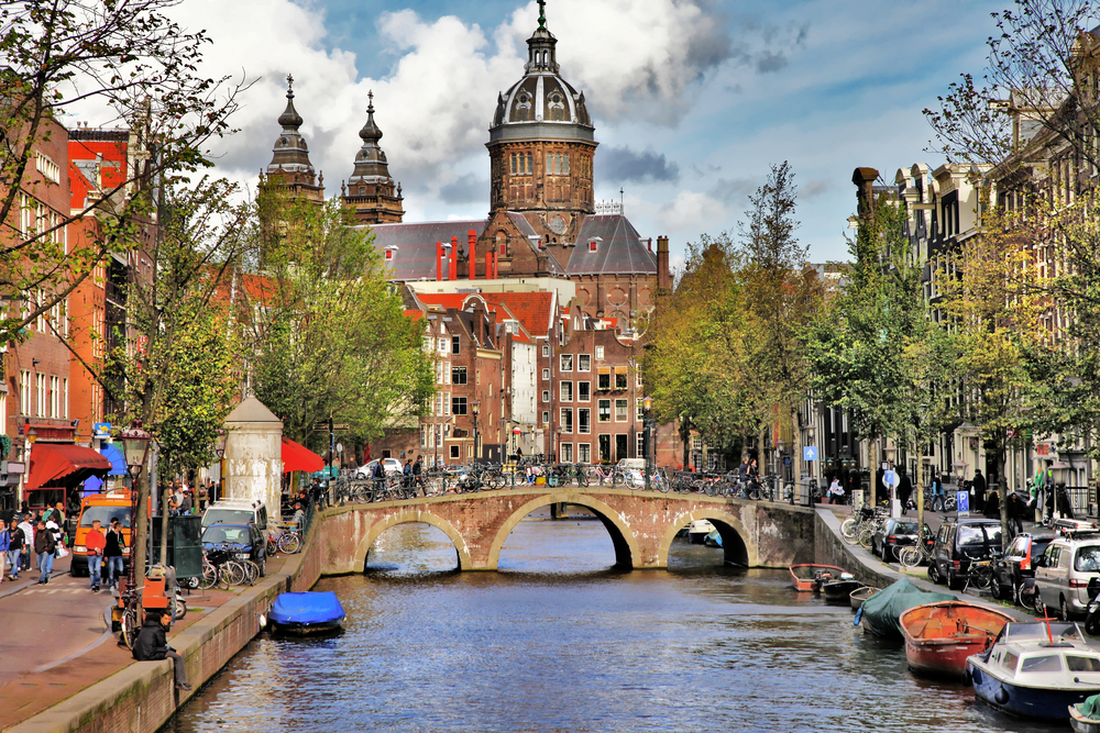 photo-of-amsterdam-canal-and-buildings