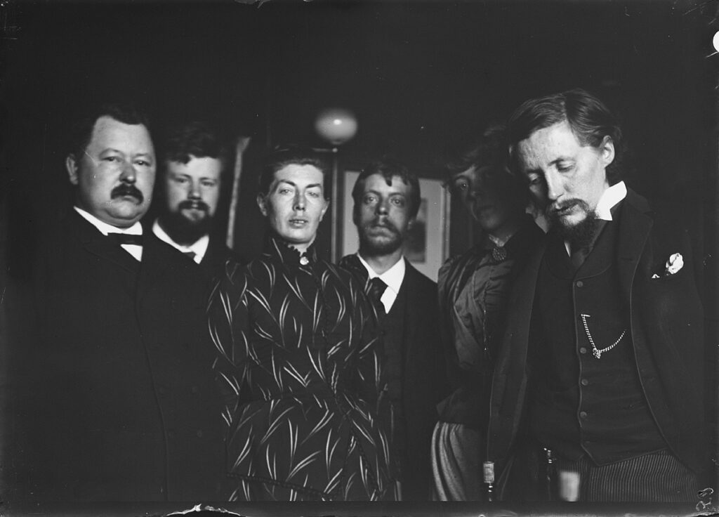 photo of Annette_Versluys-Poelman surrounded by men