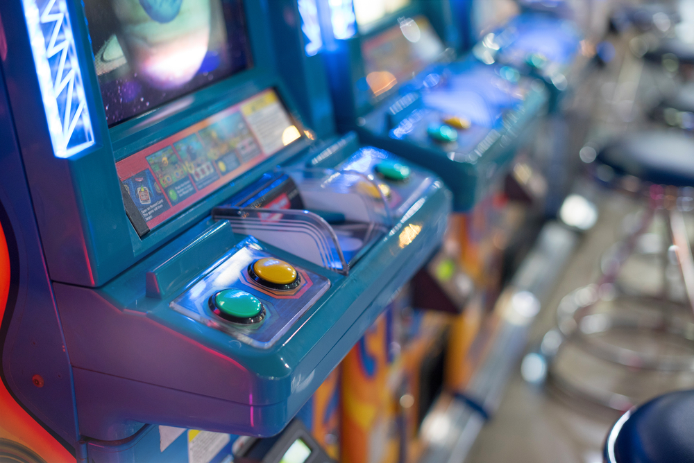 close-up-photo-of-80s-arcade-game-machines-in-colours-purple-and-blue