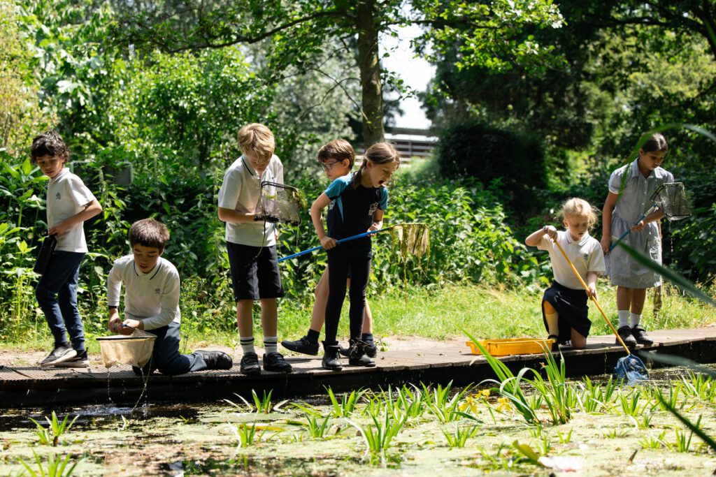 Children-learning-outdoors-at-the-forest-school-in-the-british-school-in-the-netherlands