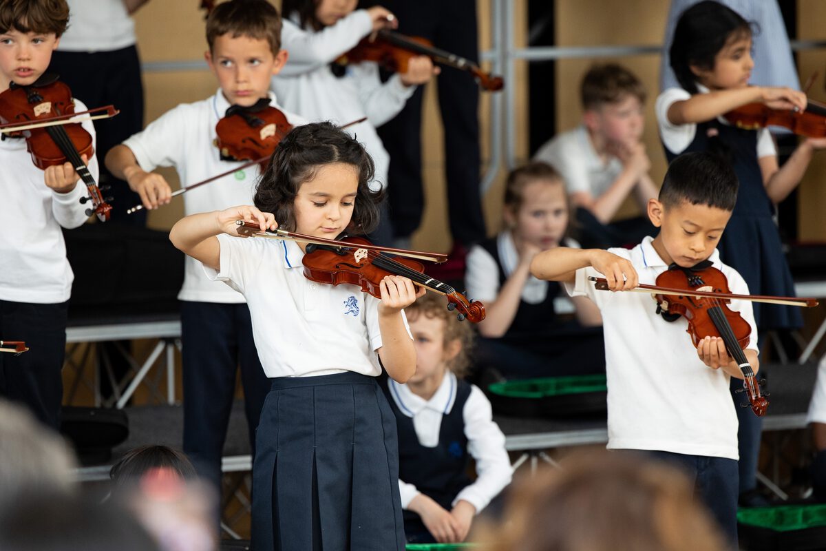 young-students-from-the-british-school-of-the-netherlands-playing-in-an-orchestra