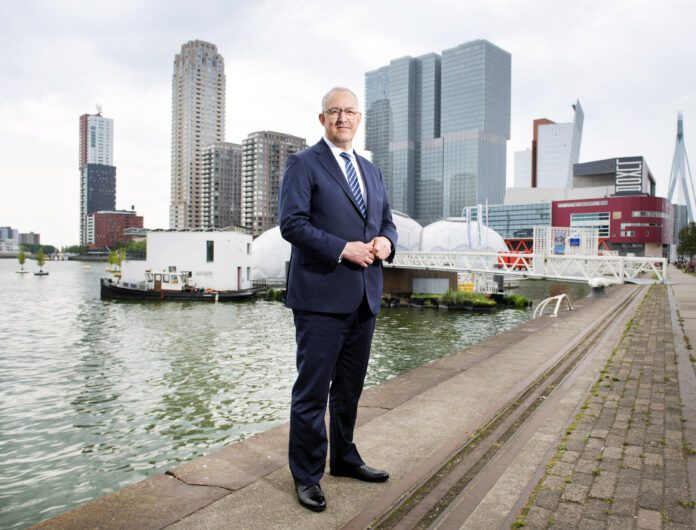 Mayor-Ahmed-Aboutaleb-stands-against-Rotterdam-background