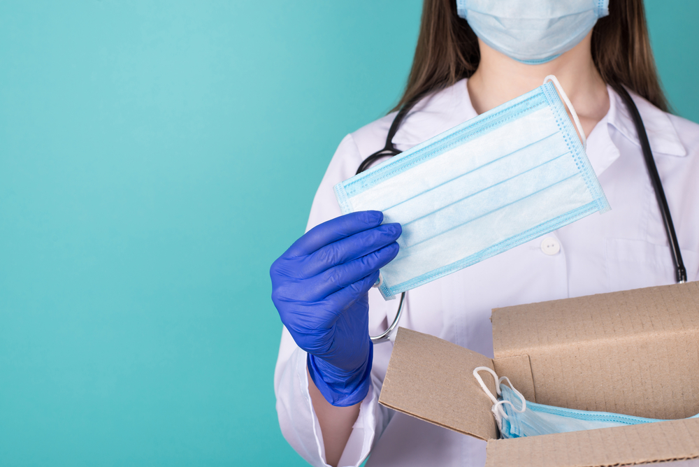 picture-of-a-health-professional-with-a-health-care-package-full-of-face-masks