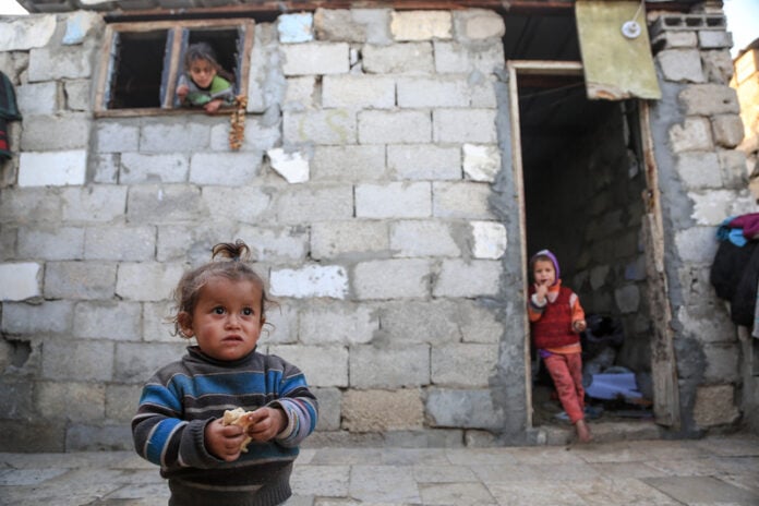 photo-of-children-in-Gaza-outside-building