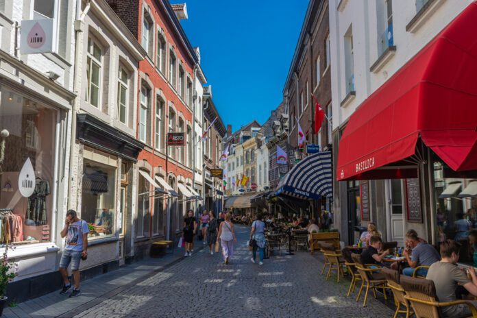 Cobbled-small-street-in-Maastricht-Netherlands-with-people-walking