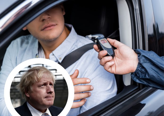 Composite-image-of-Boris-Johnson-in-front-of-a-man-taking-a-breathalyzer-test