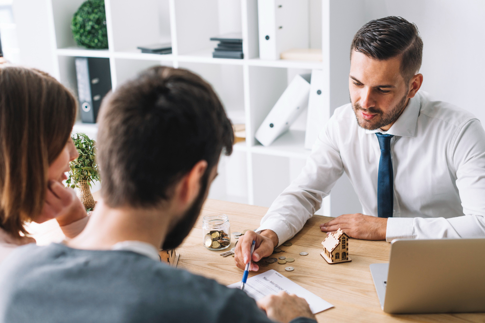 Photo-of-couple-discussing-borrowing-power-with-mortgage-consultant-Netherlands