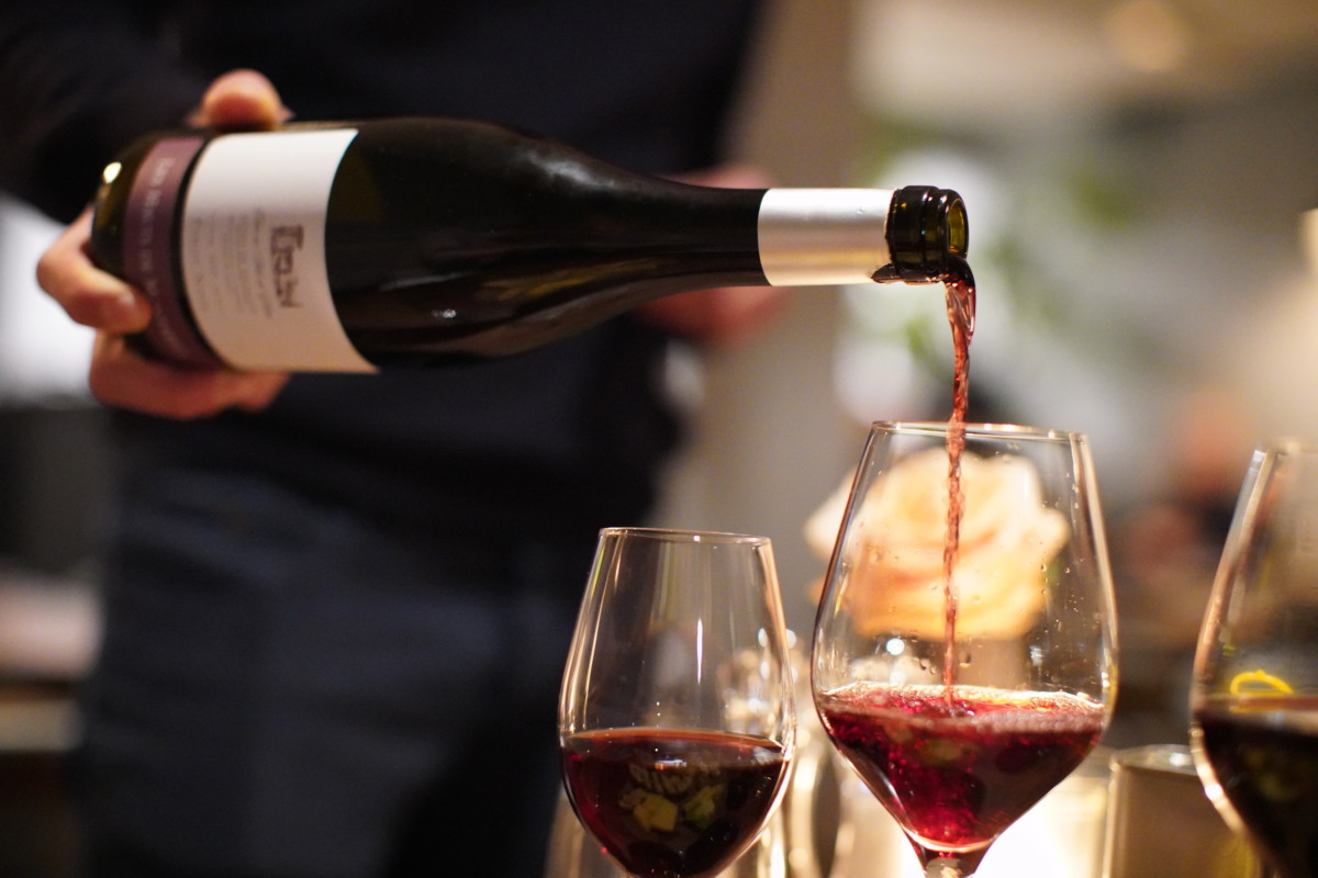 Waiter-pouring-wine-at-vanderveen-restaurant-in-amsterdam-the-netherlands