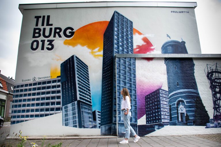 photo-of-a-girl-in-front-of-a-mural-in-tilburg