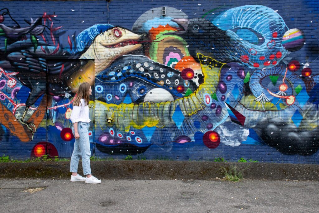 photo-of-a-girl-looking-at-street-art-in-tilburg