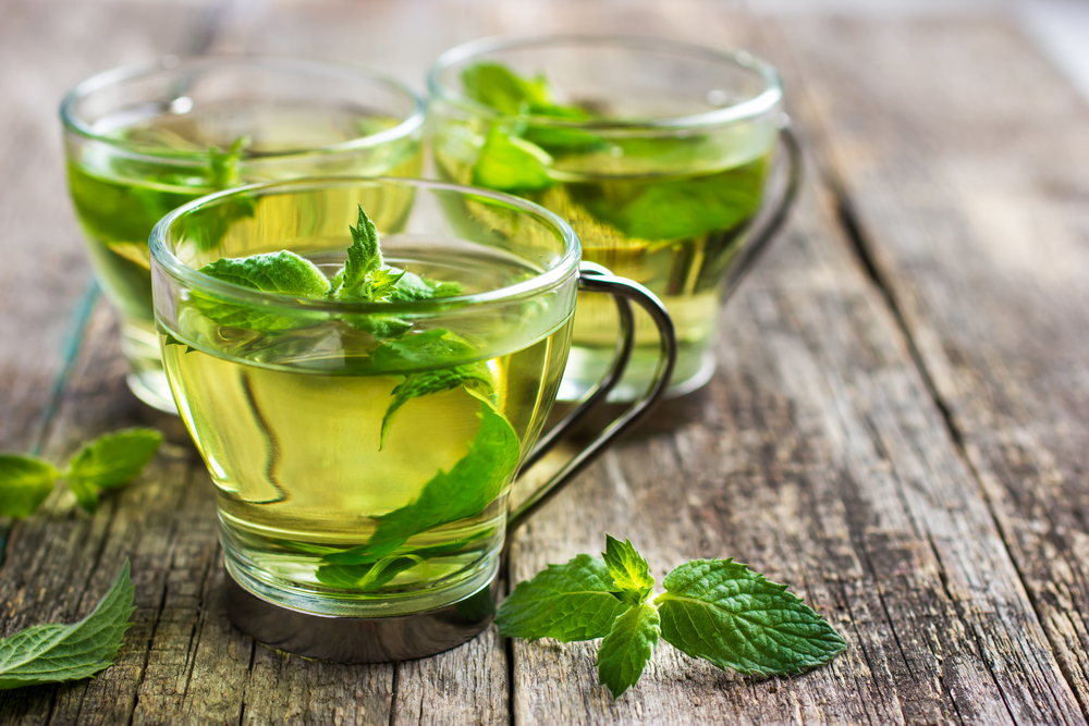 fresh-mint-tea-in-glass-cups-on-wooden-background-in-Netherlands 