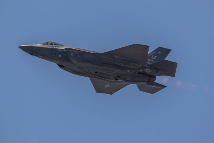 Dutch-F-35-fighter-jet-zooming-through-blue-sky