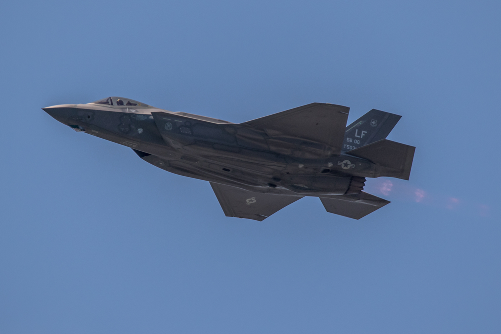 Dutch-F-35-fighter-jet-zooming-through-blue-sky