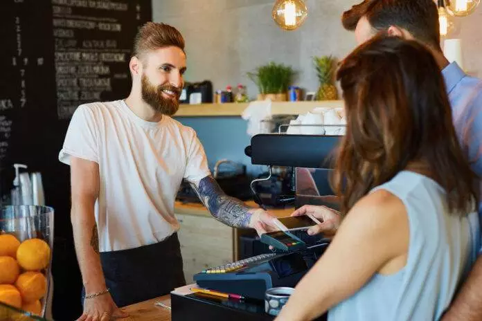 Photo-of-customers-paying-using-bank-card-in-coffee-shop-Netherlands