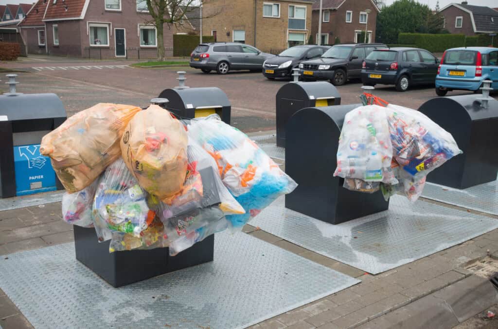 photo-of-trash-bags-over-garbage-collection-bins