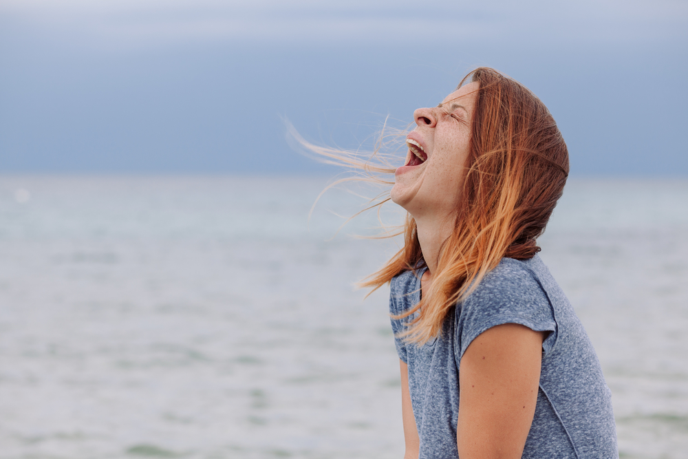Photo-of-woman-screaming-at-ocean