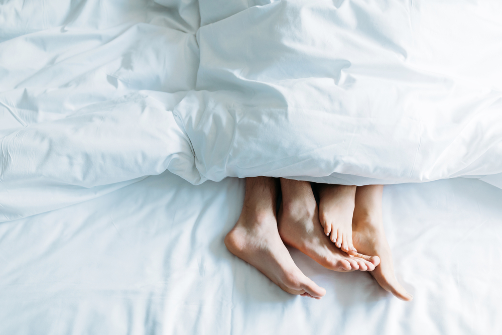 Dutch-couple's-feet-poking-out-of-the-covers-in-bed