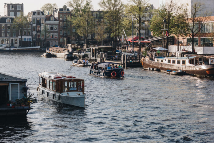 Amsterdam-canal-with-boats