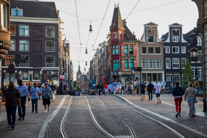 Photo-of-people-walking-through-Amsterdam