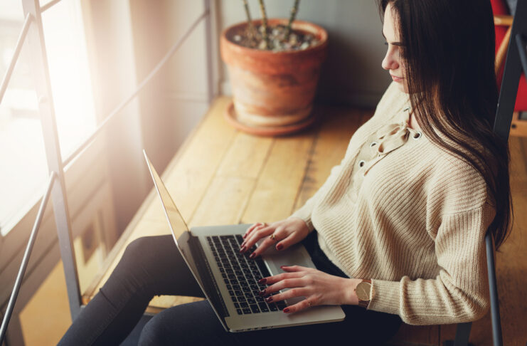photo-of-a-woman-working-from-home-on-a-laptop