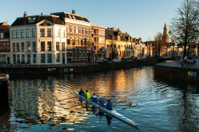 photo-of-people-rowing-on-the-canals-of-groningen-city-with-cleanest-air-in-the-netherlands