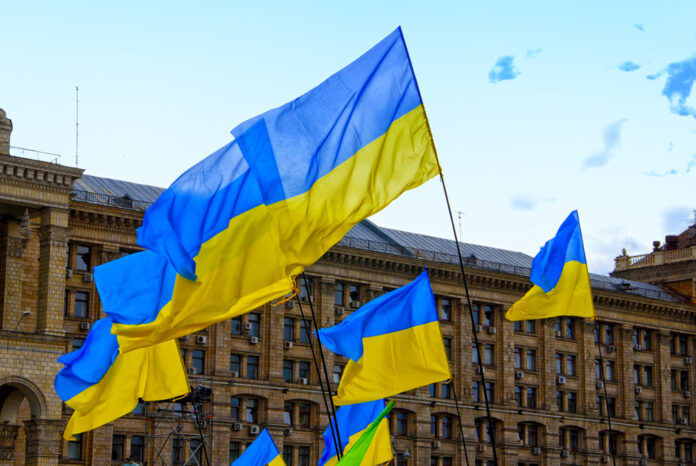 ukrainian-flags-waving-in-the-air-at-dam-square-in-amsterdam