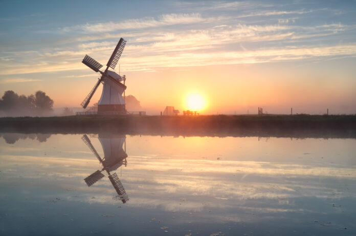 sun-rising-above-a-dutch-windmill