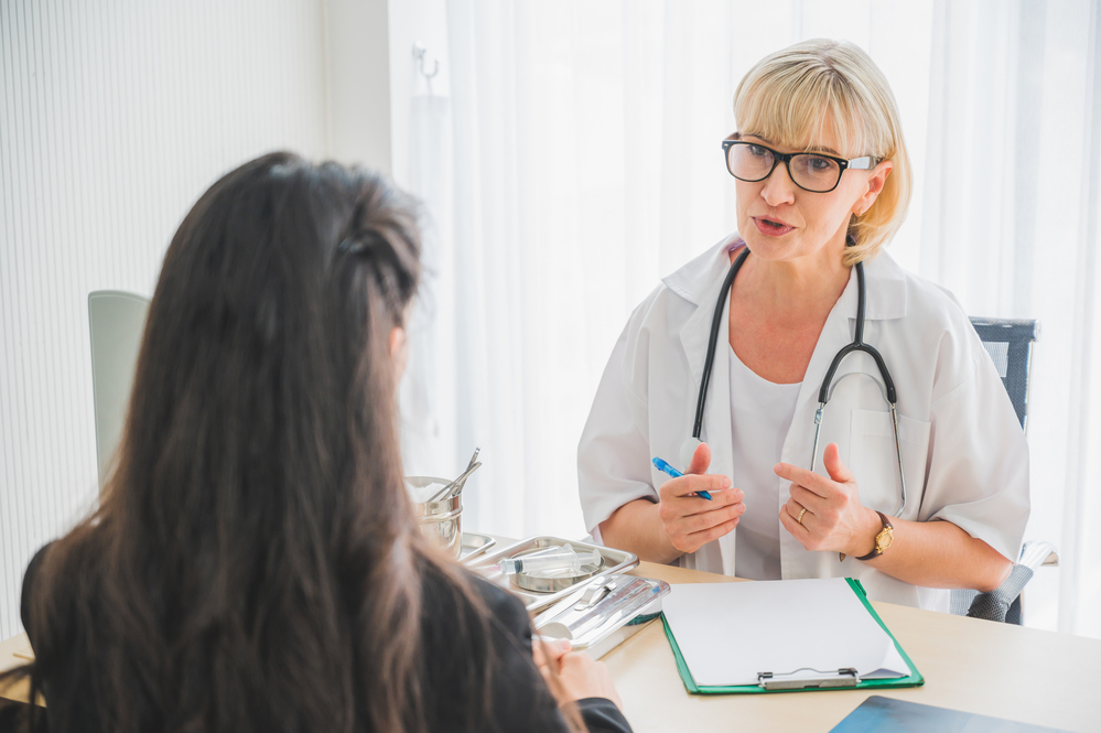 Photo-of-female-doctor-and-patient-in-doctors-office