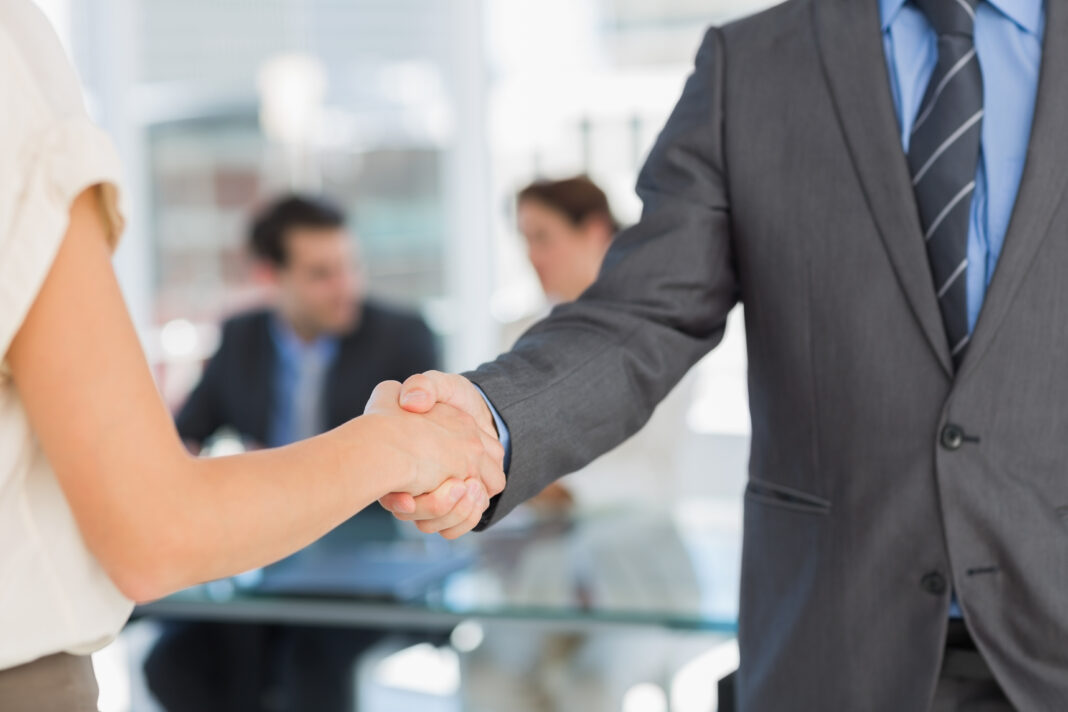 Close-up-mid-section-of handshake-to-introduce-oneself