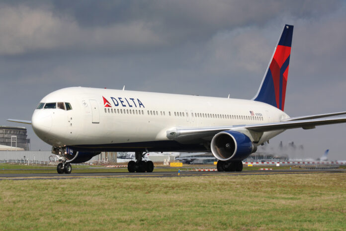 Photo of a Delta airplane on a runway.