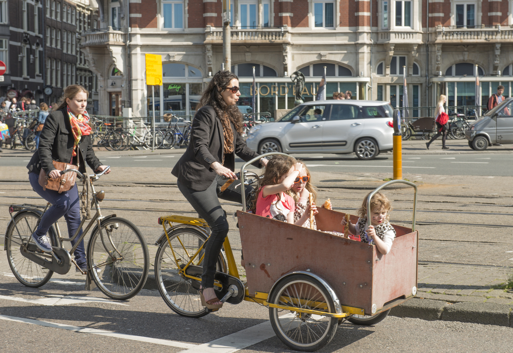 photo-of-two-women-on-bicycles-in-the-netherlands