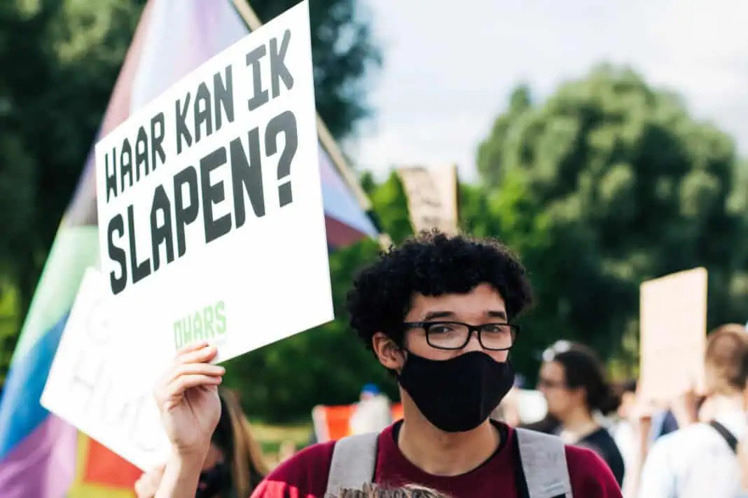 photo-of-an-international-student-protester-holding-up-a-sign-that-says-where-can-i-sleep-to-protest-against-the-housing-crisis