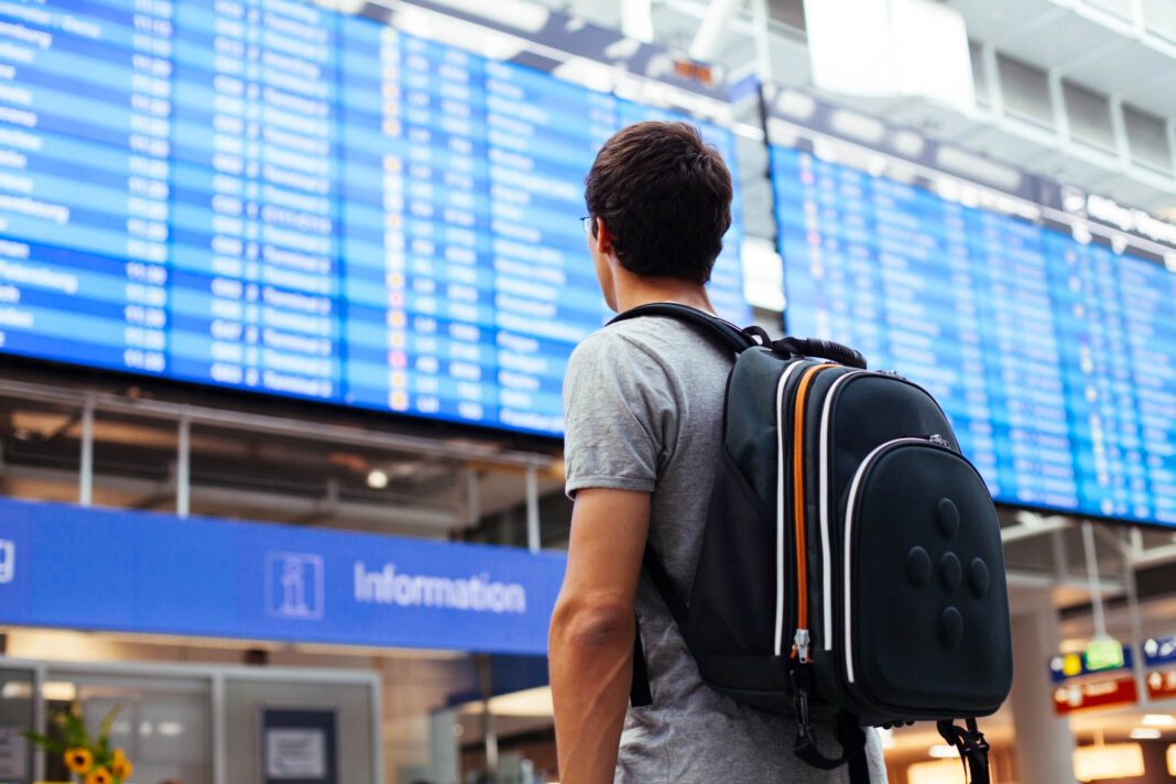 A-Dutch-man-looking-at-the-screen-at-an-airport
