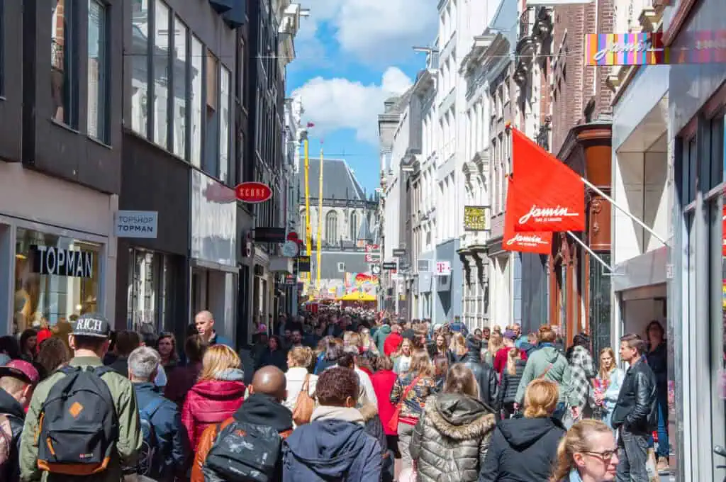 photo-of-crowded-street-in-amsterdam-central-location-sunny-cold-weather-people-walking-shopping-street-kalverstraat