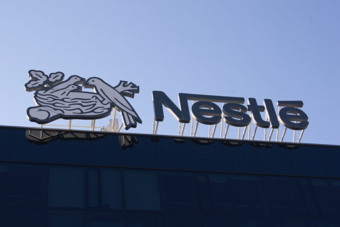 Nestlé-logo-on-top-of-a-building-against-blue-sky
