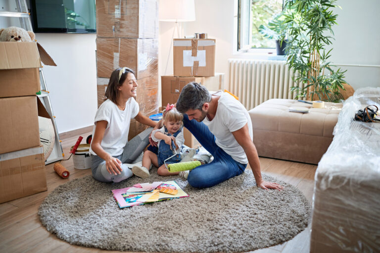 photo-of-family-sitting-in-new-home-after-using-Dutch-Real-Estate-Company-services