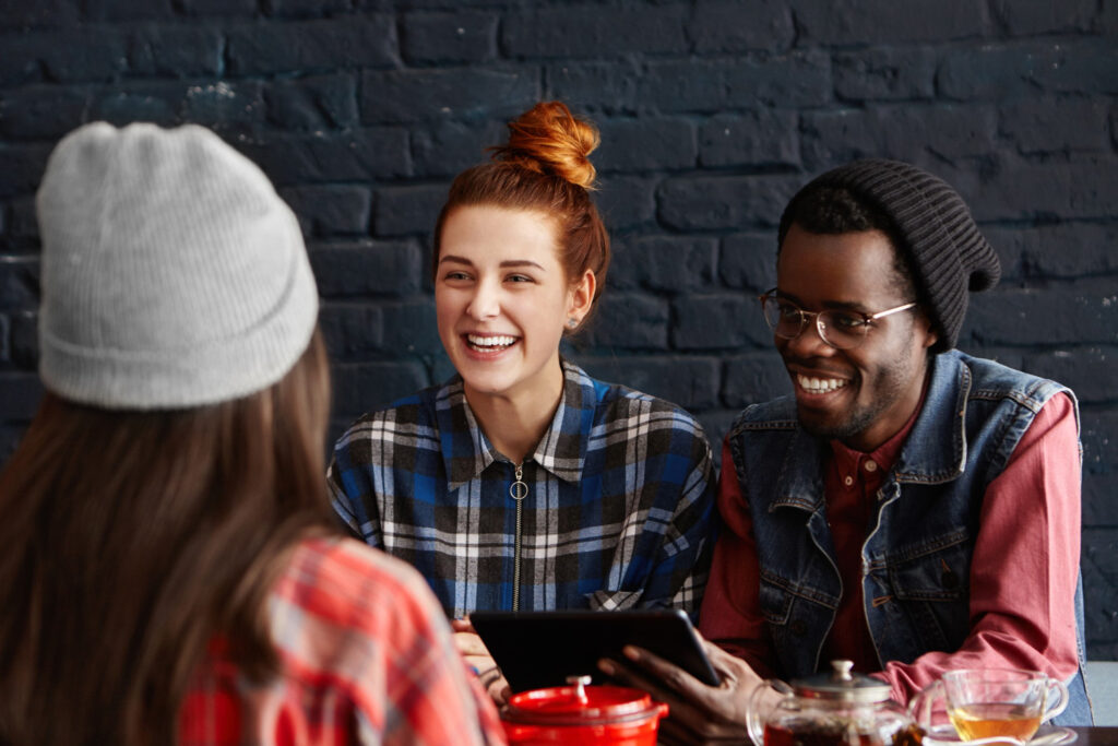 photo-of-people-sitting-in-cafe-talking-Dutch-with-eachother